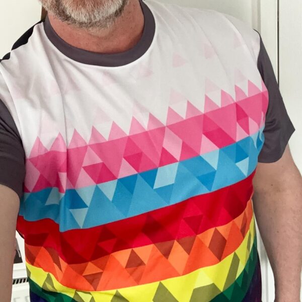 Andrew wearing the Pride geometric runinclusive t-shirt