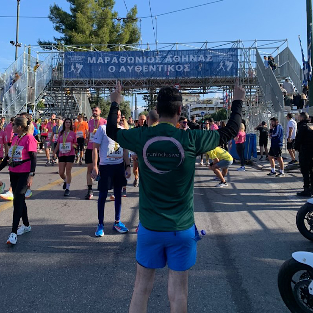 One of our supporters wearing our Bottle Green / pink runinclusive t-shirt at the Authentic Athens Marathon 10K race